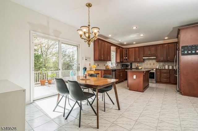 dining space with a chandelier and recessed lighting
