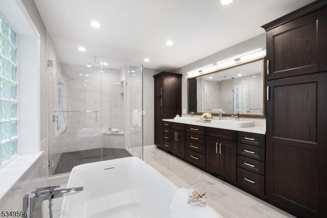 30 Mountain Ridge Dr, Livingston Twp, NJ 07039 - full bathroom featuring a stall shower, recessed lighting, double vanity, and a freestanding tub
