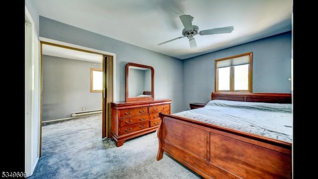 bedroom featuring light colored carpet, ceiling fan, and baseboard heating