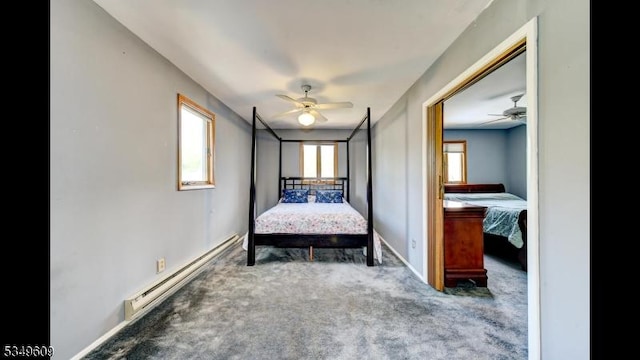 bedroom with baseboards, a baseboard radiator, and carpet