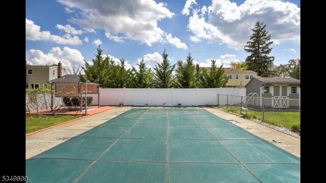view of pool with fence and a fenced in pool