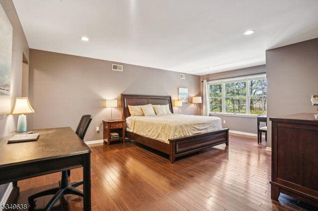 bedroom featuring baseboards, recessed lighting, visible vents, and hardwood / wood-style flooring