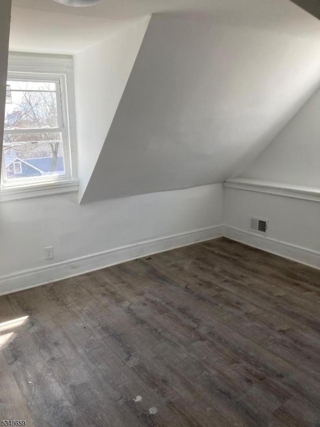214 Cleveland St, City Of Orange Twp, NJ 07050 - bonus room featuring dark wood-style flooring, visible vents, baseboards, and vaulted ceiling