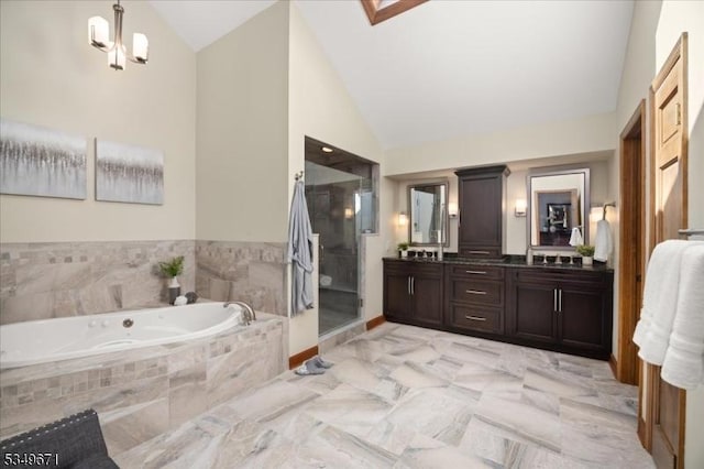 full bathroom with vaulted ceiling, a bath, a shower stall, and vanity