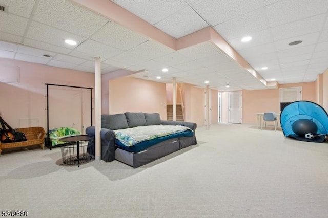 living area featuring recessed lighting, visible vents, and carpet