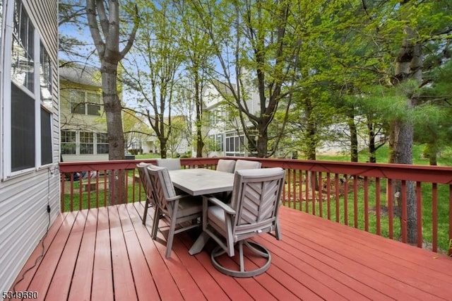 wooden terrace featuring outdoor dining area
