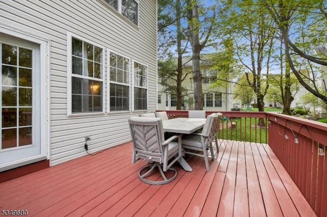 deck featuring outdoor dining area