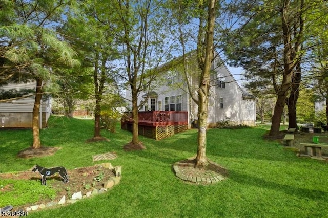 view of yard featuring a deck