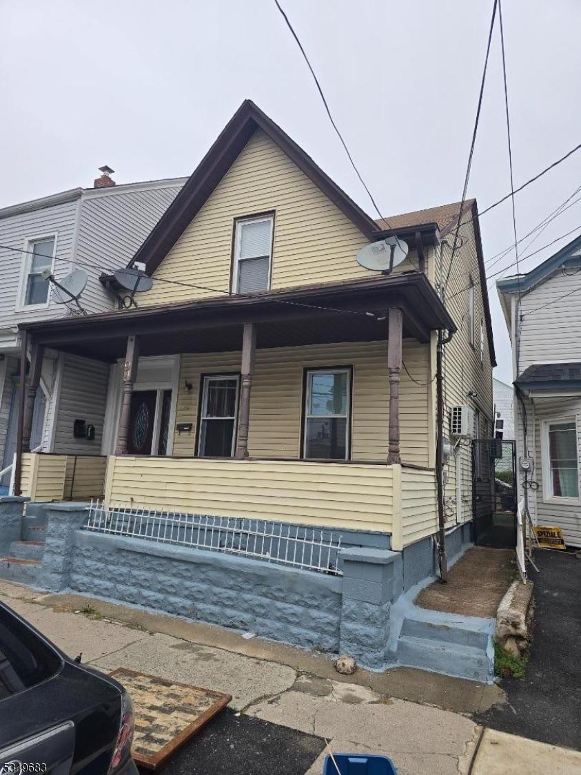 94 Manchester Ave, Paterson City, NJ 07502 - view of front of property with a porch