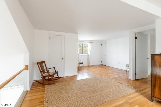 unfurnished room featuring light wood-style floors and baseboards