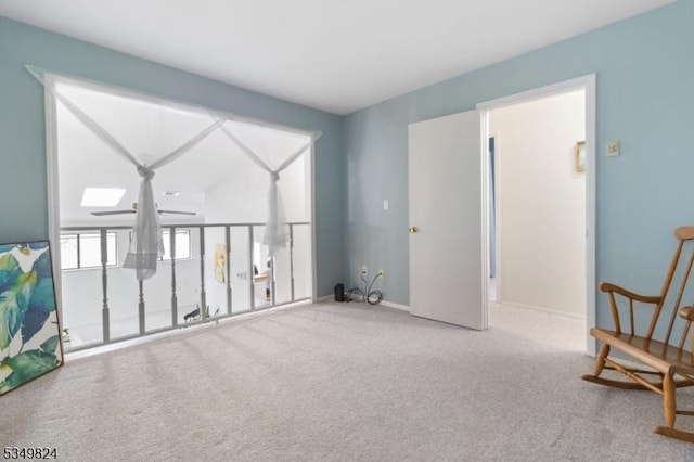 unfurnished room featuring carpet floors and baseboards