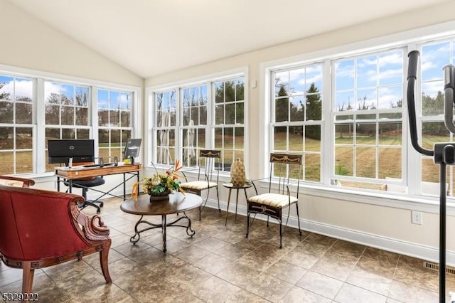 sunroom with visible vents, baseboards, and vaulted ceiling