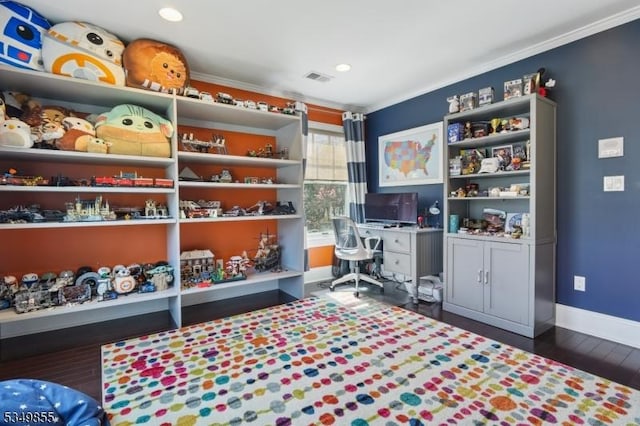 home office featuring dark wood finished floors, baseboards, ornamental molding, and visible vents