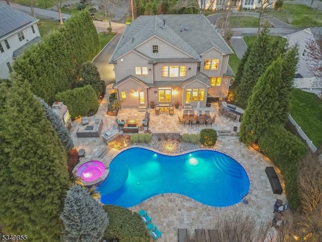 outdoor pool featuring a patio area, outdoor dining area, an outdoor living space, and area for grilling
