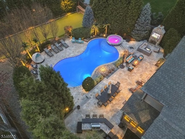 view of swimming pool with a patio