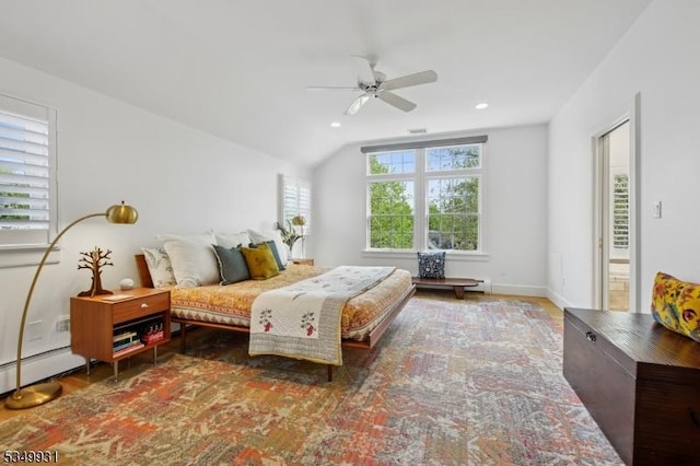 bedroom with ceiling fan, vaulted ceiling, wood finished floors, a baseboard heating unit, and recessed lighting