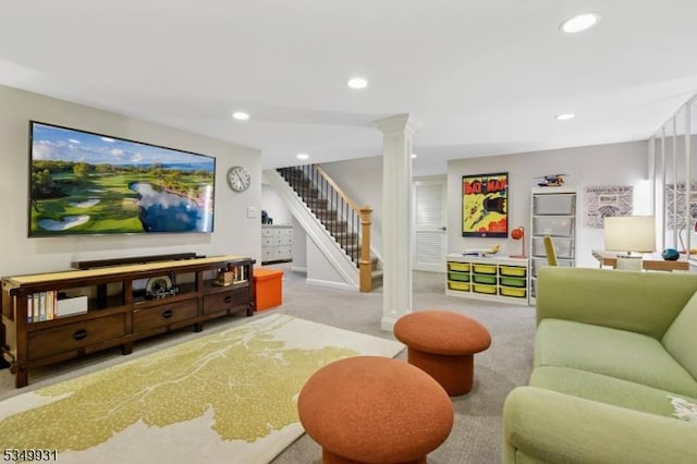 carpeted living area with stairs, ornate columns, and recessed lighting