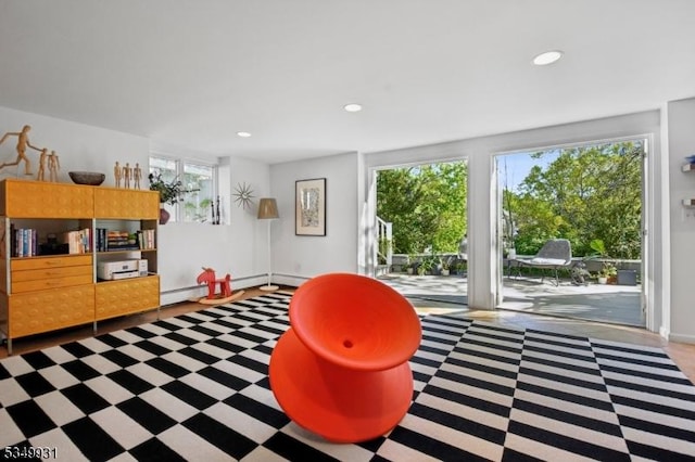 playroom featuring tile patterned floors, a baseboard radiator, baseboards, and recessed lighting