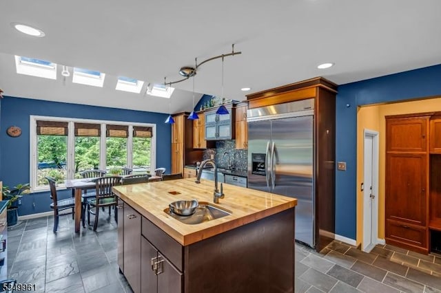 1056 Buxton Rd, Bridgewater Twp, NJ 08807 - kitchen featuring built in fridge, butcher block countertops, a sink, baseboards, and recessed lighting