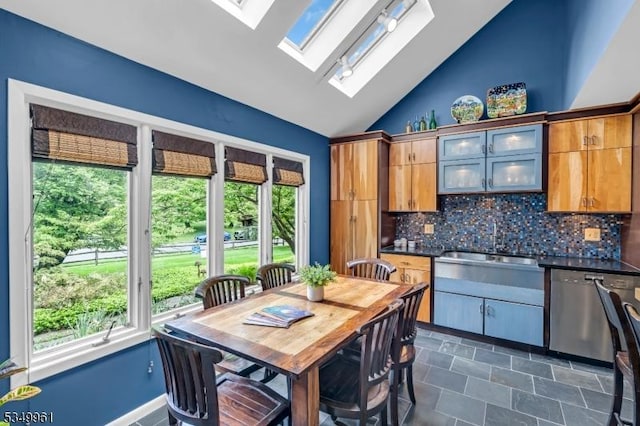1056 Buxton Rd, Bridgewater Twp, NJ 08807 - kitchen featuring stainless steel dishwasher, healthy amount of natural light, lofted ceiling, a skylight, and tasteful backsplash