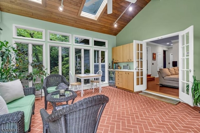 1056 Buxton Rd, Bridgewater Twp, NJ 08807 - sunroom featuring french doors, lofted ceiling, beverage cooler, a skylight, and rail lighting