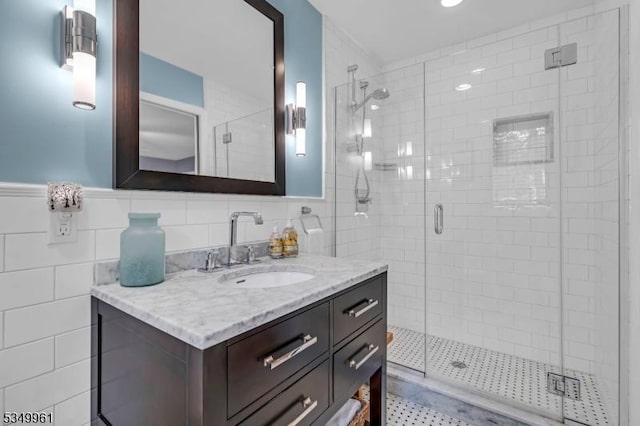 1056 Buxton Rd, Bridgewater Twp, NJ 08807 - bathroom with vanity, a stall shower, tile walls, and wainscoting
