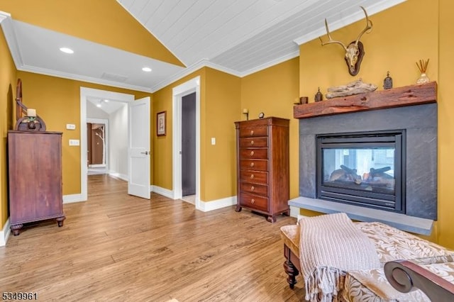 1056 Buxton Rd, Bridgewater Twp, NJ 08807 - living area featuring vaulted ceiling, crown molding, a multi sided fireplace, light wood finished floors, and recessed lighting