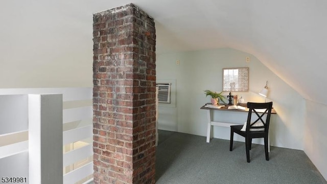 interior space featuring a wall mounted air conditioner, lofted ceiling, and carpet floors