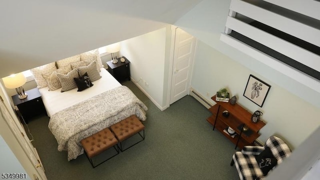 bedroom with carpet and a baseboard radiator