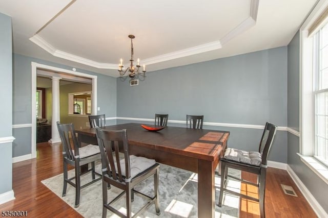 8 Marcin Way, Mount Olive Twp, NJ 07836 - dining space with a tray ceiling, decorative columns, plenty of natural light, and ornamental molding
