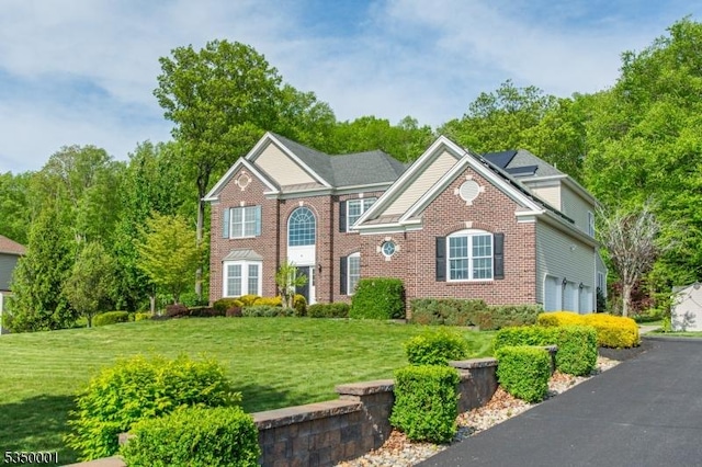 8 Marcin Way, Mount Olive Twp, NJ 07836 - colonial-style house with a garage, a front yard, and brick siding