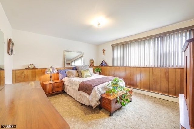 carpeted bedroom with baseboard heating