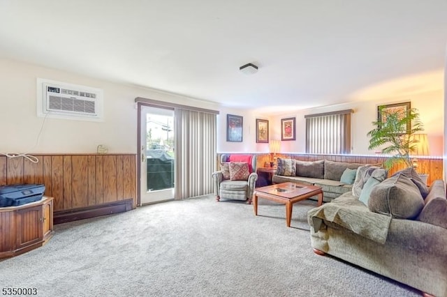 carpeted living room with a wainscoted wall, a wall mounted air conditioner, and wood walls
