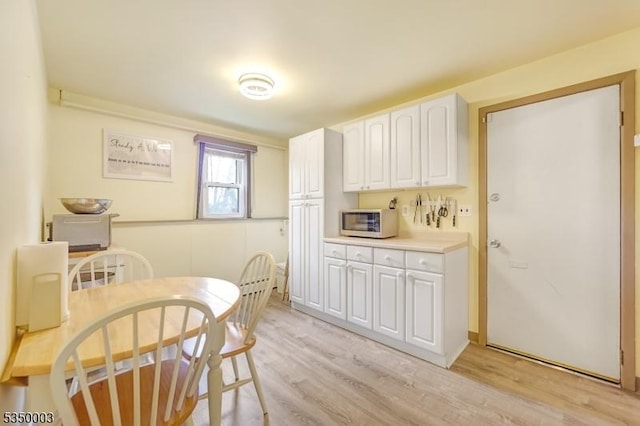 dining room with light wood-type flooring