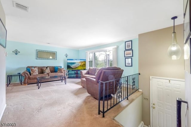 living area with light colored carpet and crown molding