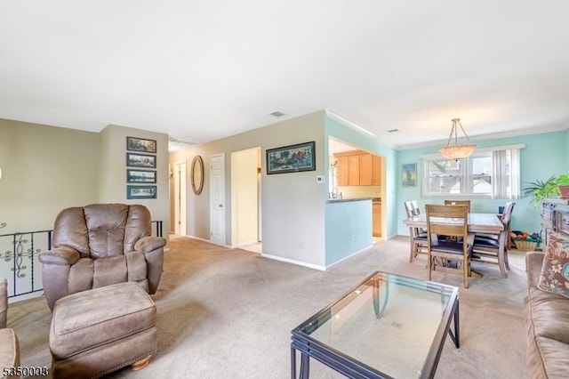 living room with light carpet and baseboards