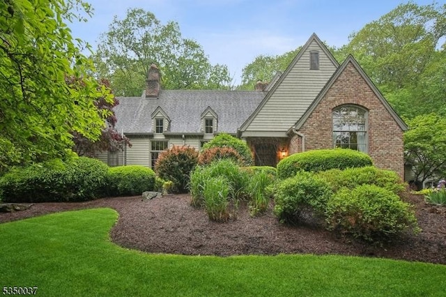 9 Valley View Dr, Lebanon Twp, NJ 07830 - view of front of home with a front yard, a chimney, and brick siding