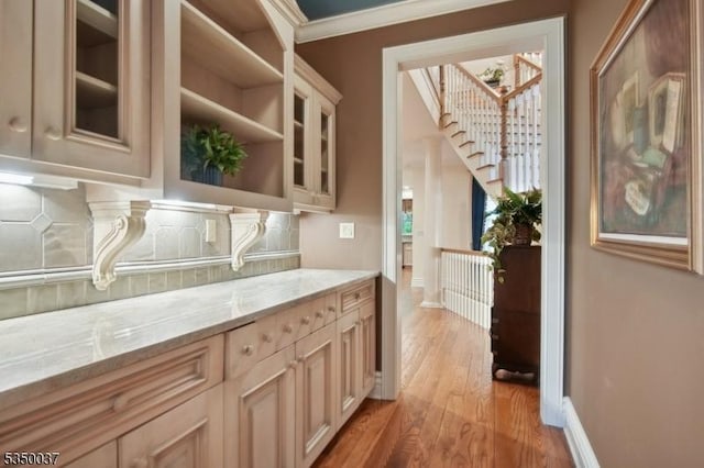9 Valley View Dr, Lebanon Twp, NJ 07830 - kitchen featuring light wood-type flooring, light stone counters, decorative backsplash, glass insert cabinets, and open shelves