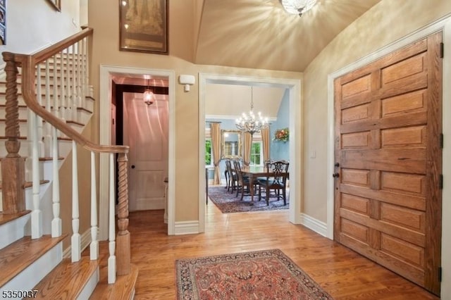 9 Valley View Dr, Lebanon Twp, NJ 07830 - foyer entrance featuring stairway, a chandelier, baseboards, light wood-type flooring, and lofted ceiling