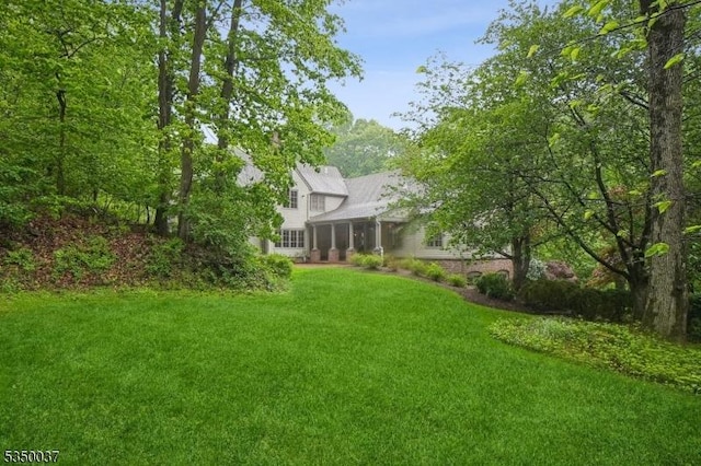 9 Valley View Dr, Lebanon Twp, NJ 07830 - view of green lawn with a sunroom