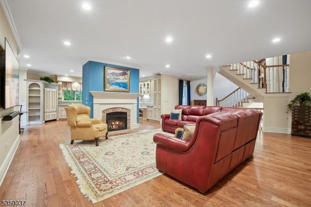 9 Valley View Dr, Lebanon Twp, NJ 07830 - living room with crown molding, stairs, light wood-style flooring, a fireplace, and recessed lighting