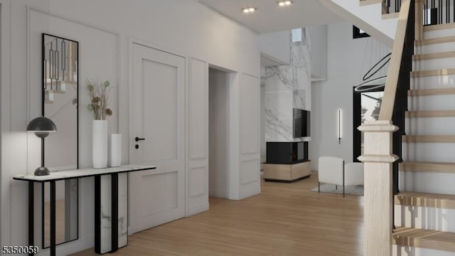 interior space featuring light wood-style flooring and stairs