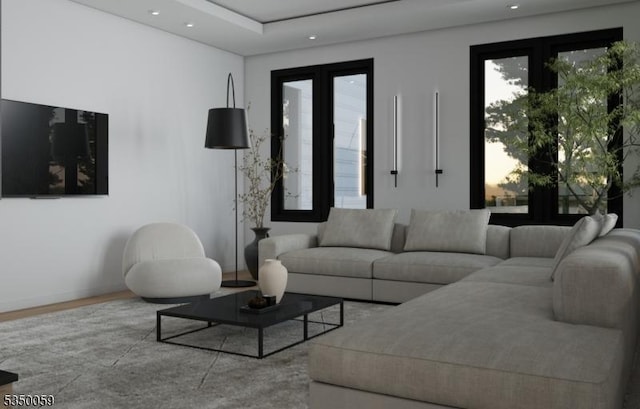 living area with wood finished floors and recessed lighting