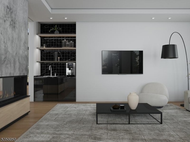 living area with recessed lighting and wood finished floors