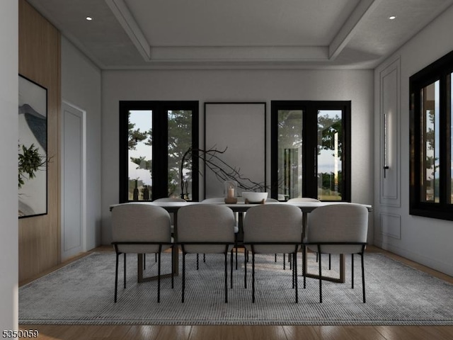 dining space with wood finished floors