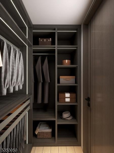 walk in closet featuring tile patterned flooring