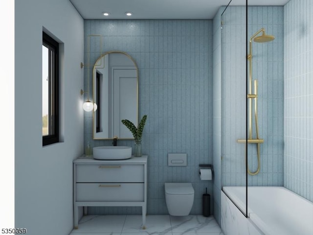 full bathroom featuring tile walls, toilet, vanity, marble finish floor, and tiled shower / bath