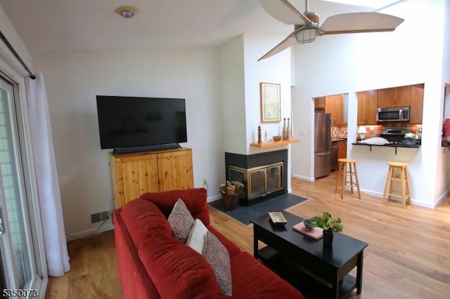 21 Crabapple Ln, Franklin Twp, NJ 08823 - living room with light wood-type flooring, a ceiling fan, and baseboards