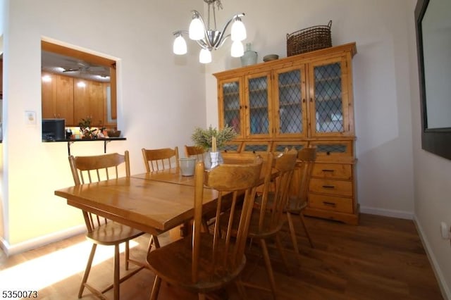21 Crabapple Ln, Franklin Twp, NJ 08823 - dining area with wood finished floors, baseboards, and a chandelier