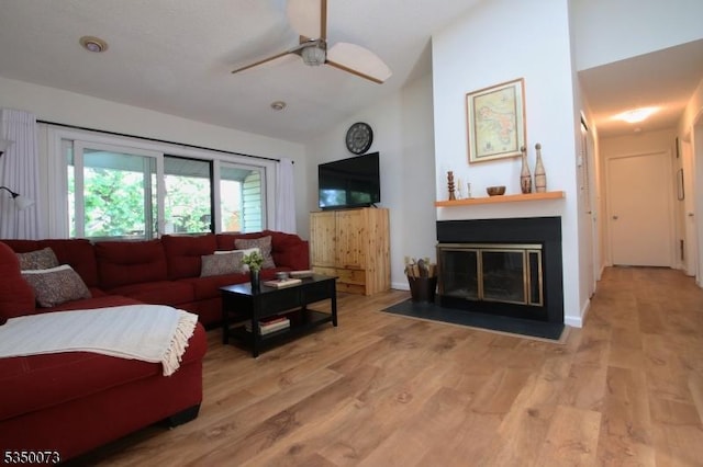 21 Crabapple Ln, Franklin Twp, NJ 08823 - living area featuring a ceiling fan, wood finished floors, a fireplace with flush hearth, and high vaulted ceiling